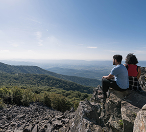 Two Shenandoah National Park visitors enjoying a scenic view